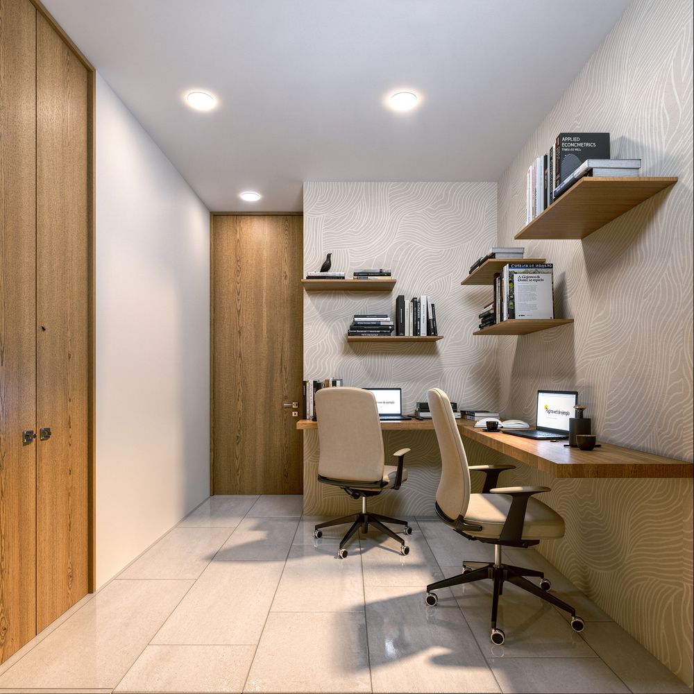 Área de coworking con escritorios y libreros